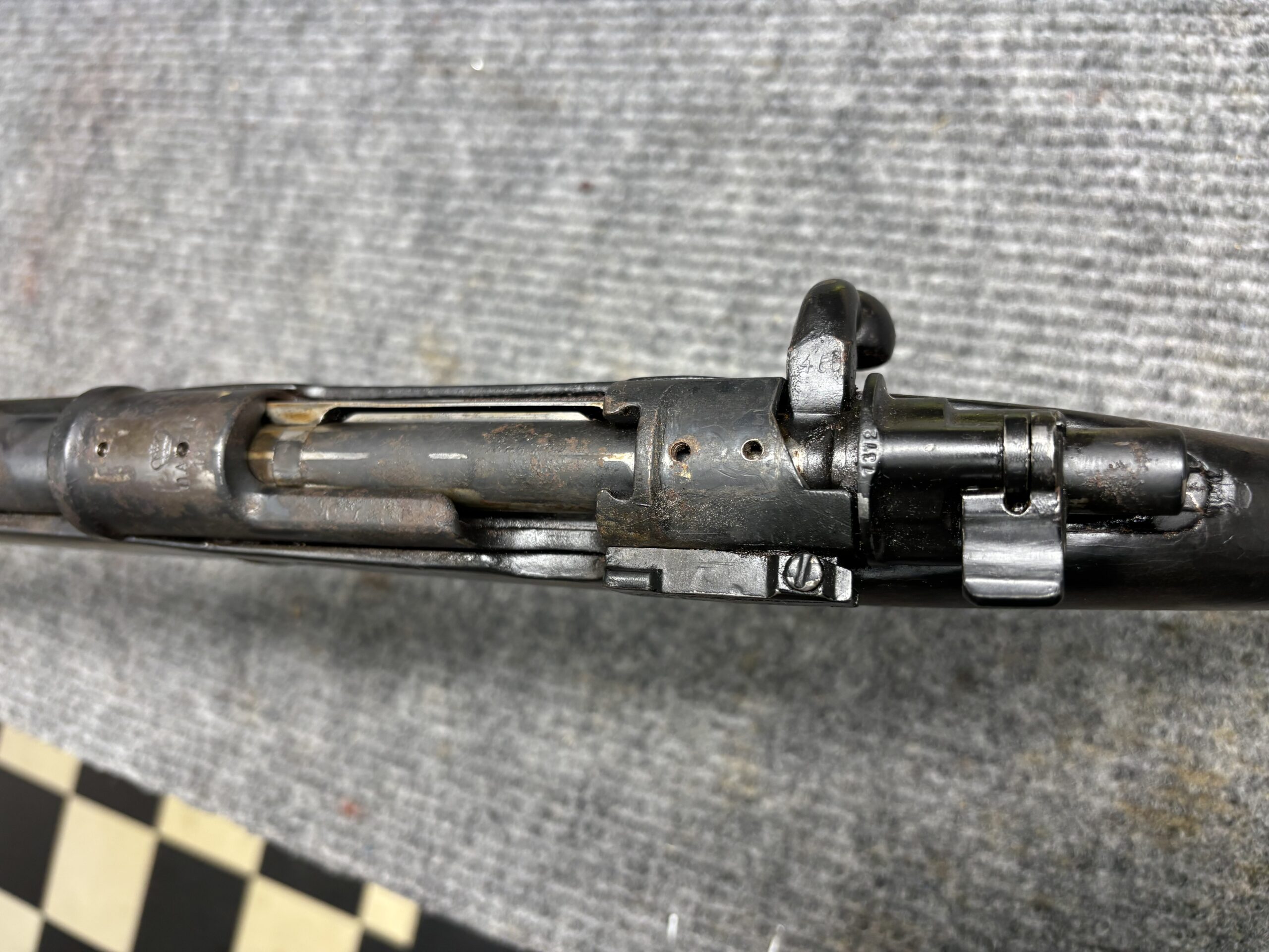 WWII German Mauser rifle action before restoration, with rusted metal, at Drop Tine Guns in Staunton, VA